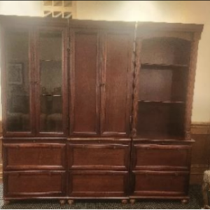 Antique wooden display cabinet with glass-paneled doors and rich dark wood finish, ideal for vintage storage and home décor