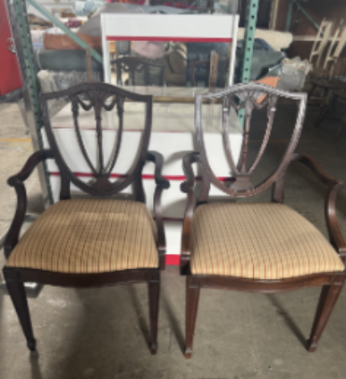 Pair of wood shield-back armchairs with striped upholstered seats.