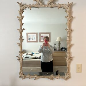 Ornate carved vintage wall mirror.