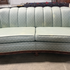 Carved wood barrel back sofa with upholstered cushions