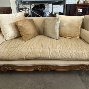 Marge Carson upholstered sofa with carved wood frame and scroll arms